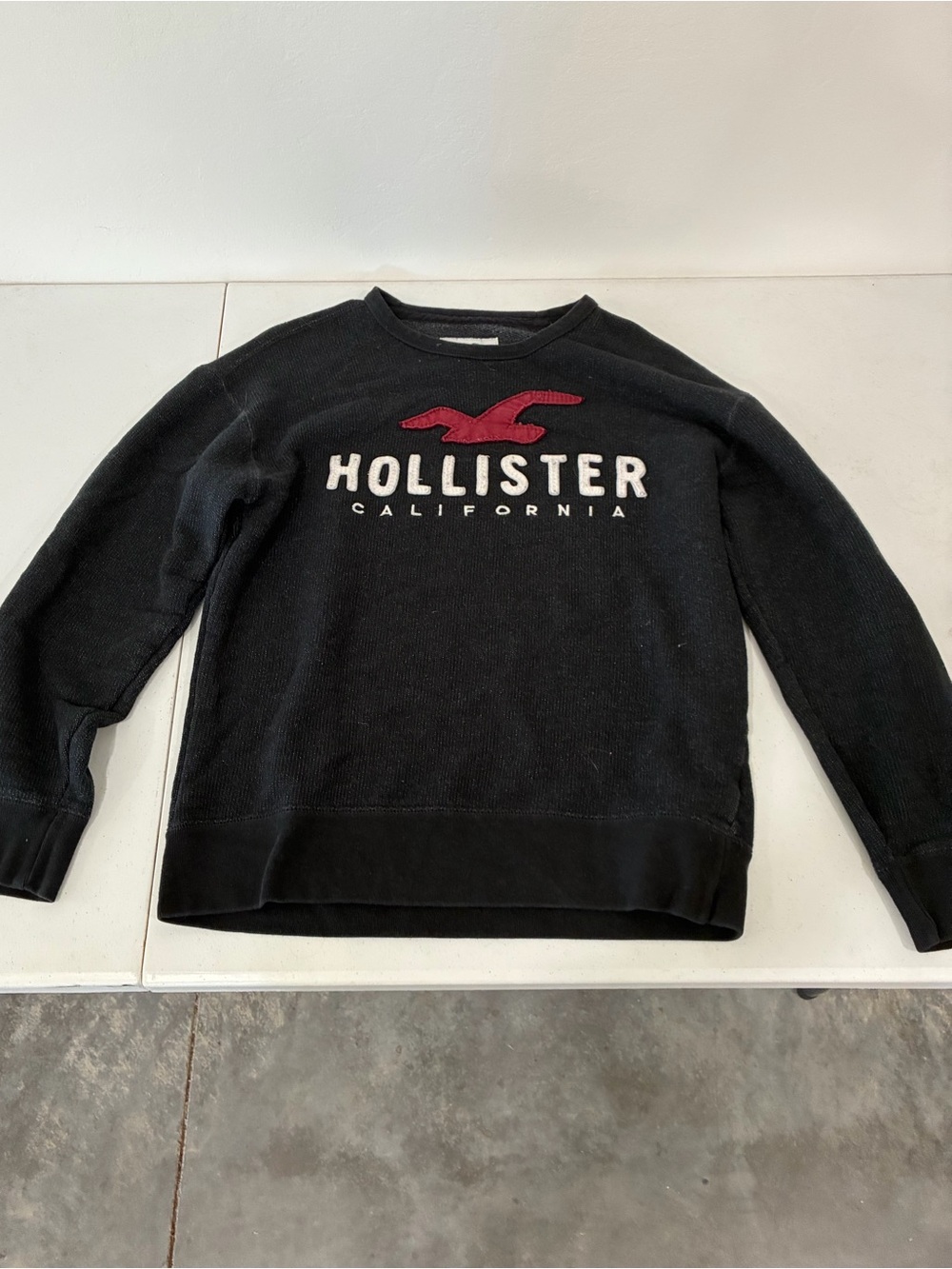 Hollister Black Crewneck Sweatshirt with Red Logo